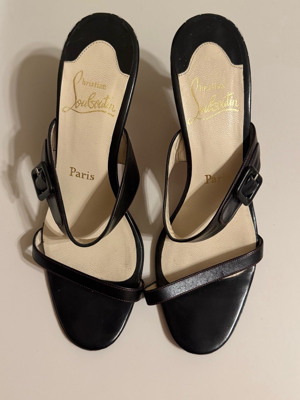 Christian Louboutin size 38=8 black leather slides buckle detail on the strap.